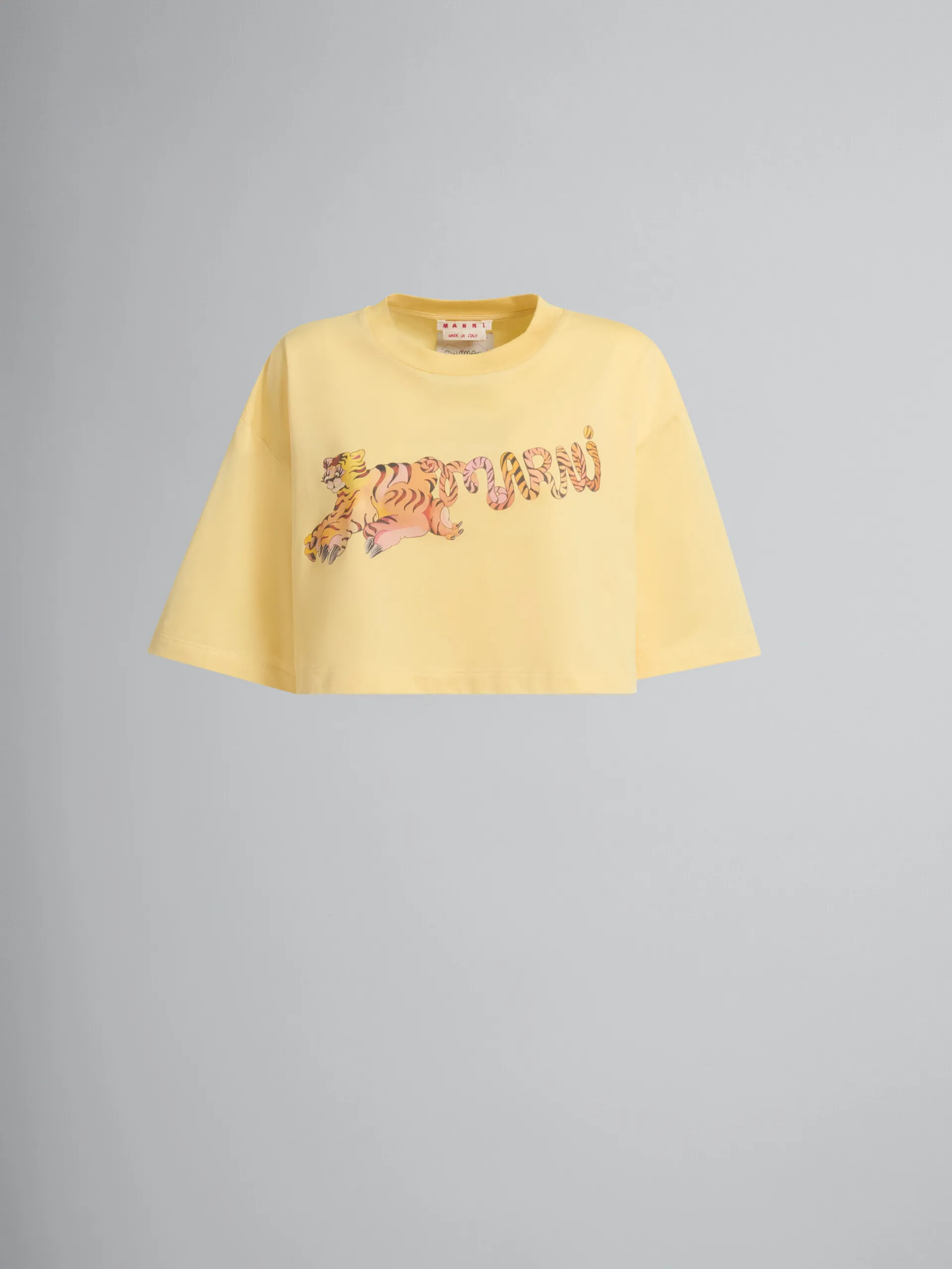 Camiseta crop de algodón orgánico amarilla con estampado