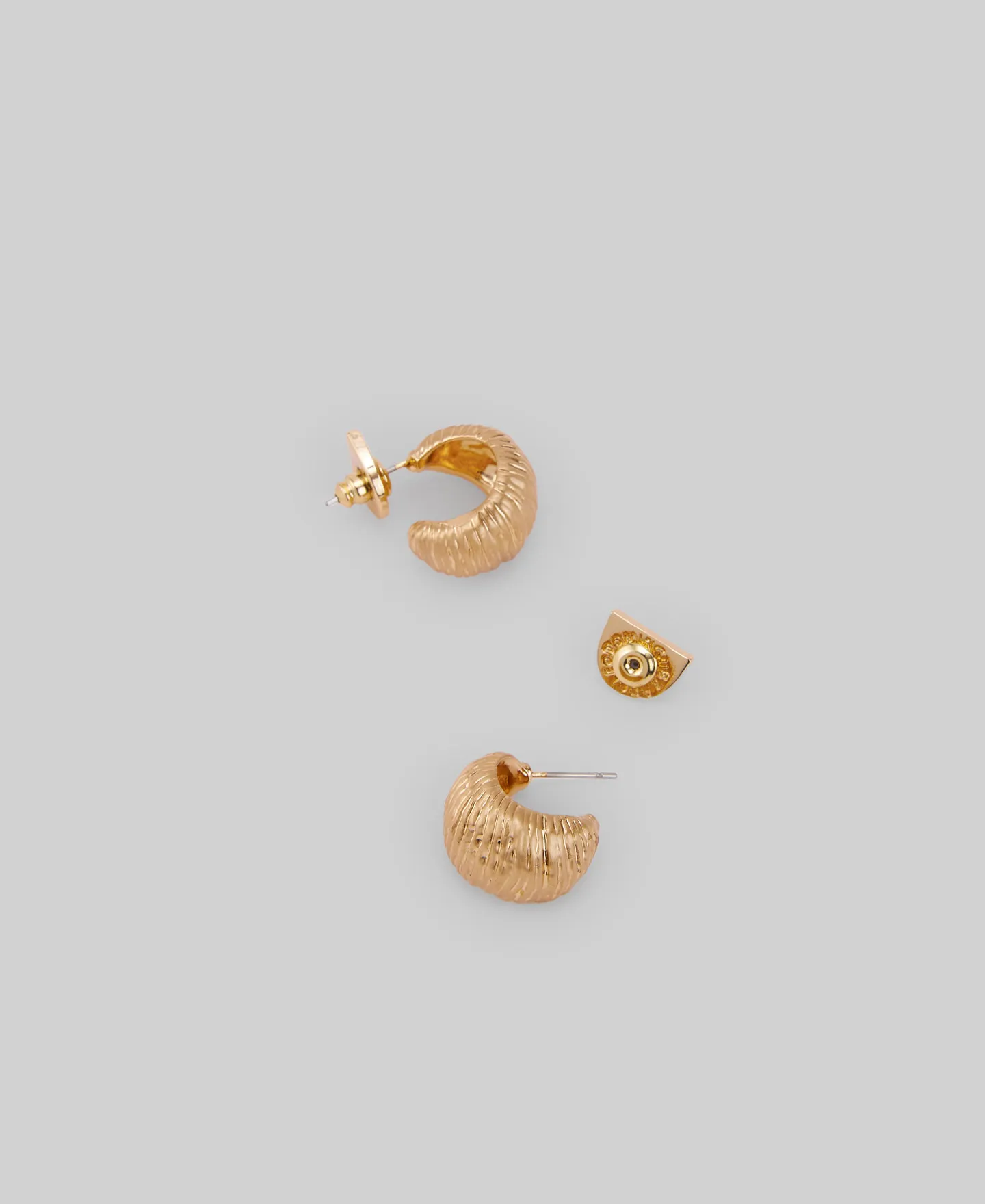 Golden hoops with a shell relief woman