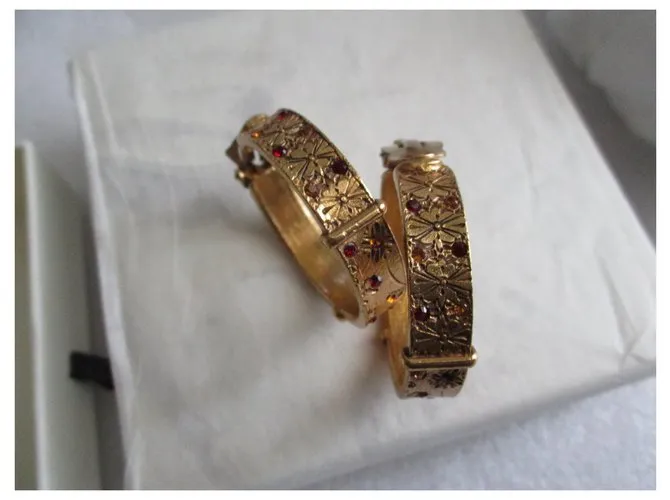 Kenzo Aros barrocos. Dorado 