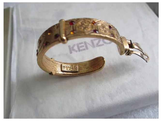 Kenzo Aros barrocos. Dorado 