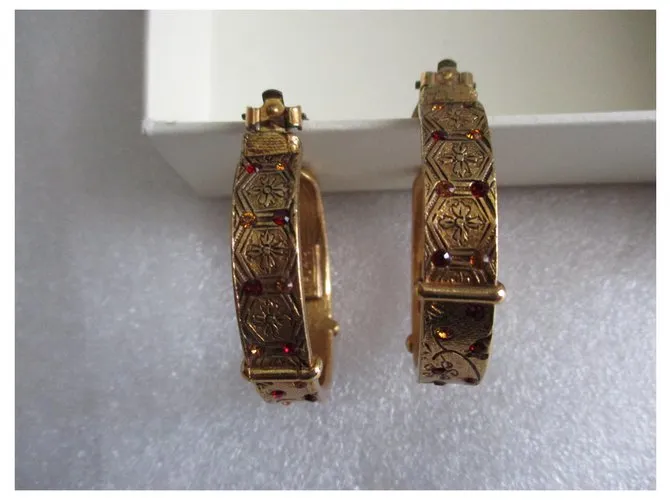 Kenzo Aros barrocos. Dorado 