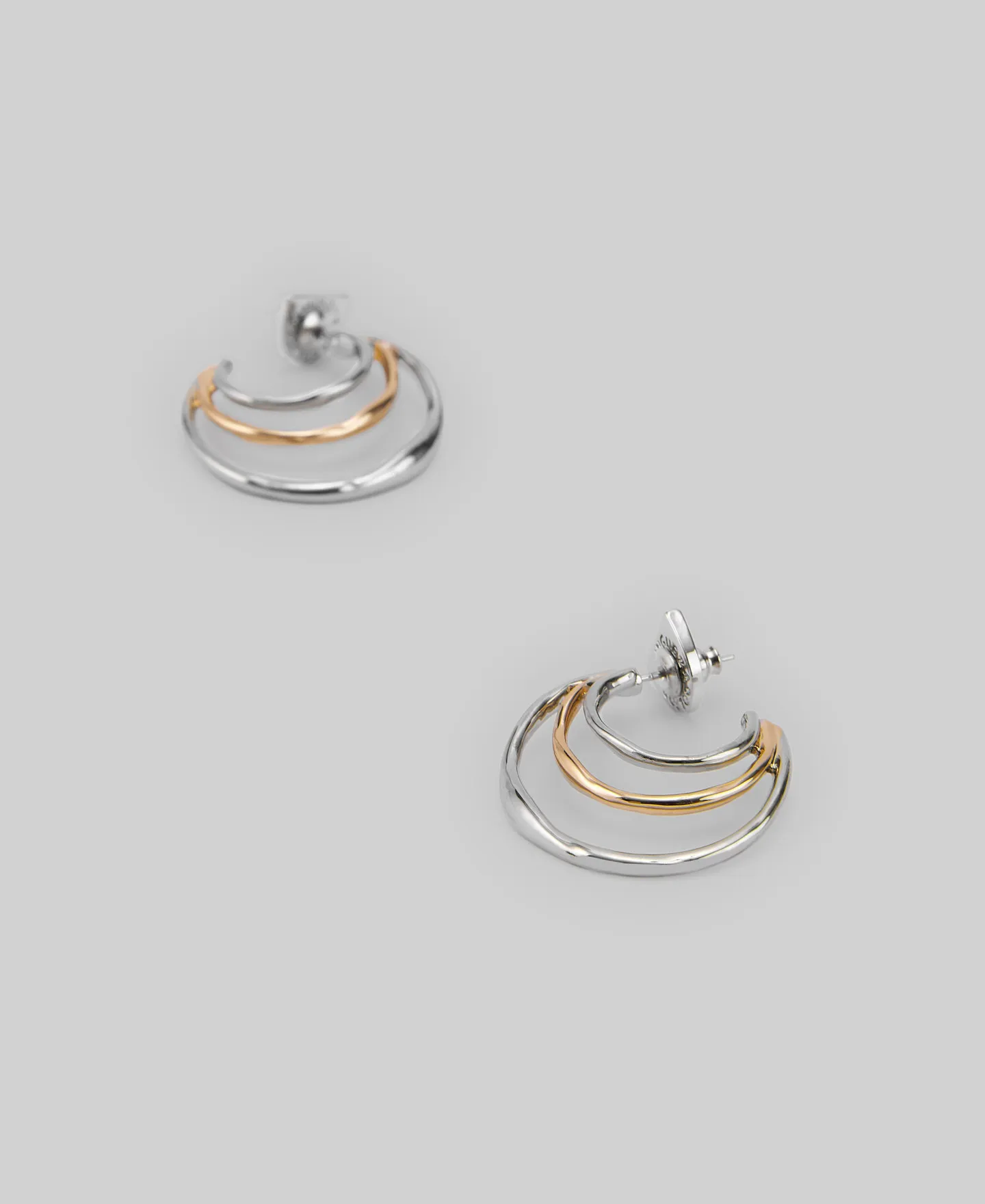 Metal earrings with tree hoops woman