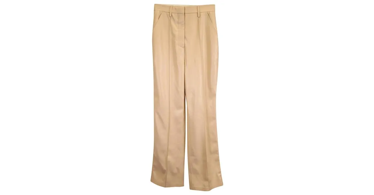 Pantalones Leena de Nanushka en poliuretano beige 