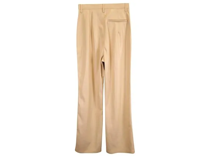 Pantalones Leena de Nanushka en poliuretano beige 